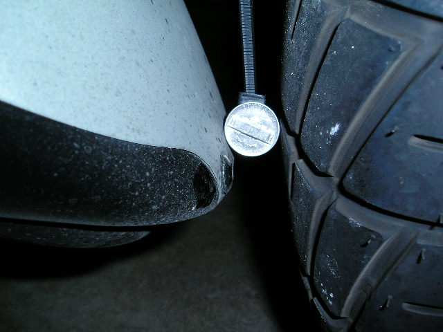 Tire clearance as compared to a Nickel.  Actual clearance is 1 inch