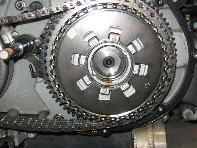 An internal snap ring retained the clutch lifter. Easy to remove. Nut is 1-3/16" with left-hand threads.