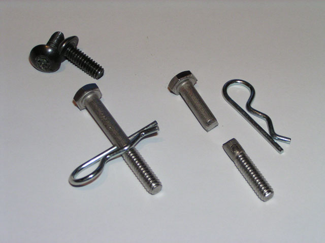 Bolt and retaining clip fabricated to hold the Firebolt seat and allow quick-release.  Stock screws shown for comparison.