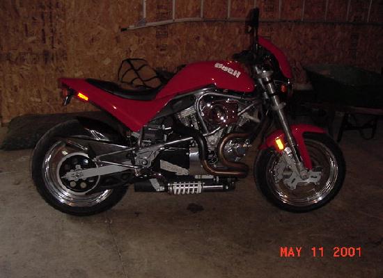 Another pic of my new project, is this snap red?  I had a 1997 billet metallic S1, and unfortunately traded it in on the HD, missed out on all the fun last year.  Bubbled tank on one side and a hypercharger on the other.  Anything to look out for on the 96's in particular?